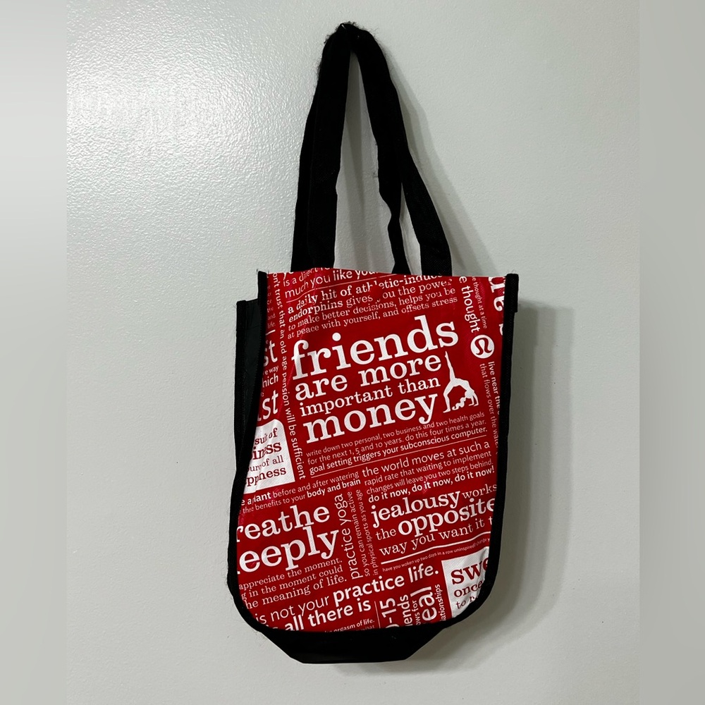 Lululemon black and red shopping bag.